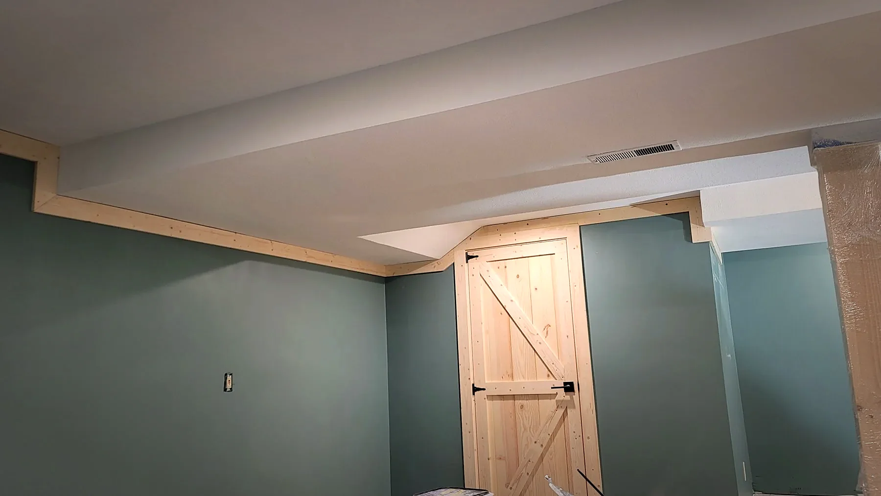 Textured ceiling and painted soffit trim, finished by hand