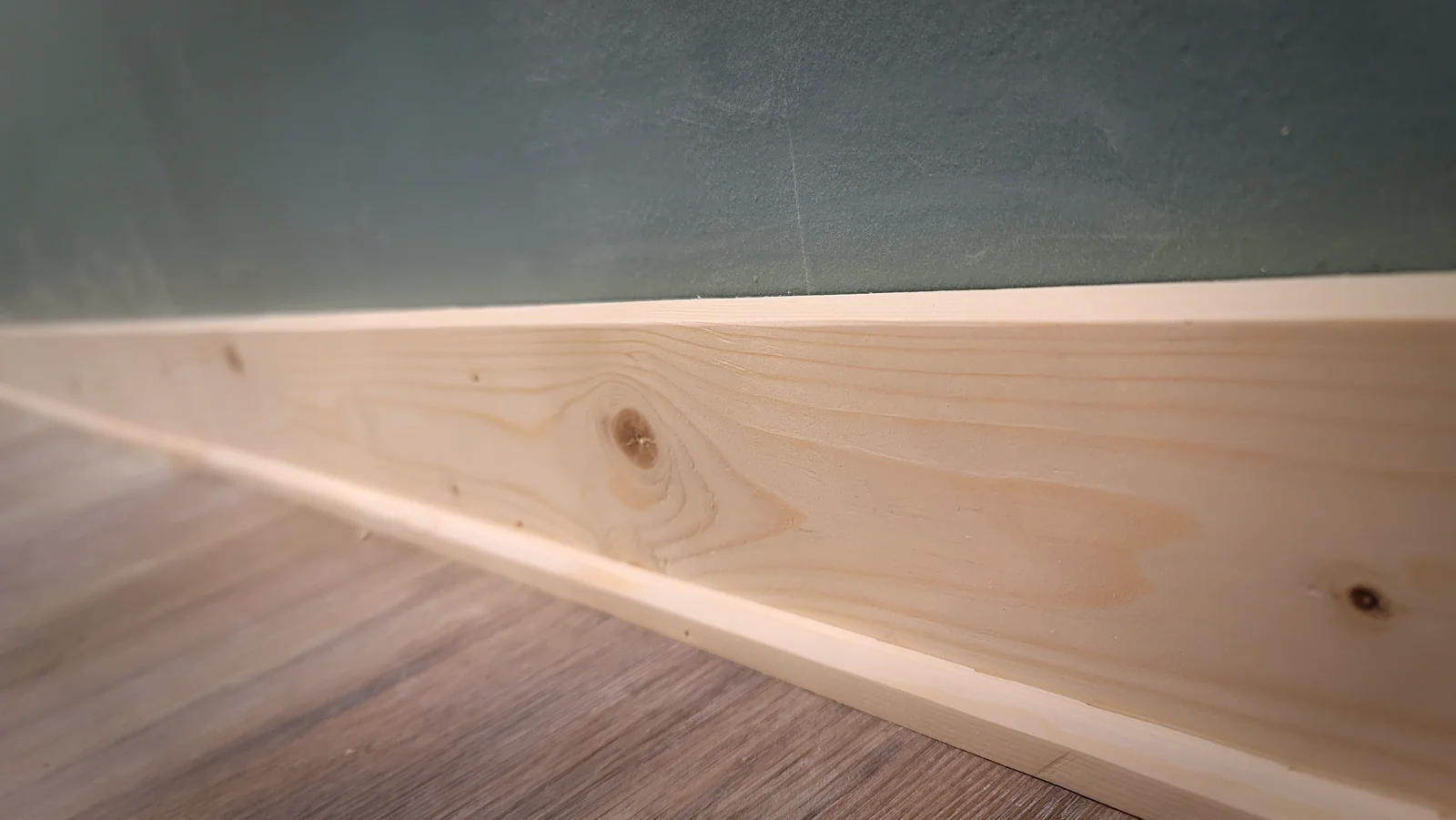 Mitered baseboard corner detail