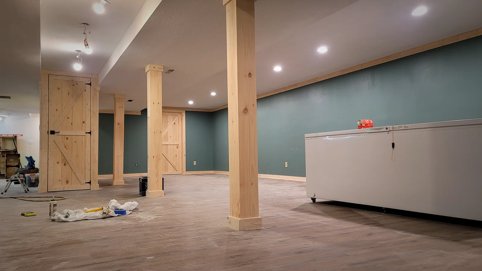 Box-beam columns, crown molding, and matching barn doors