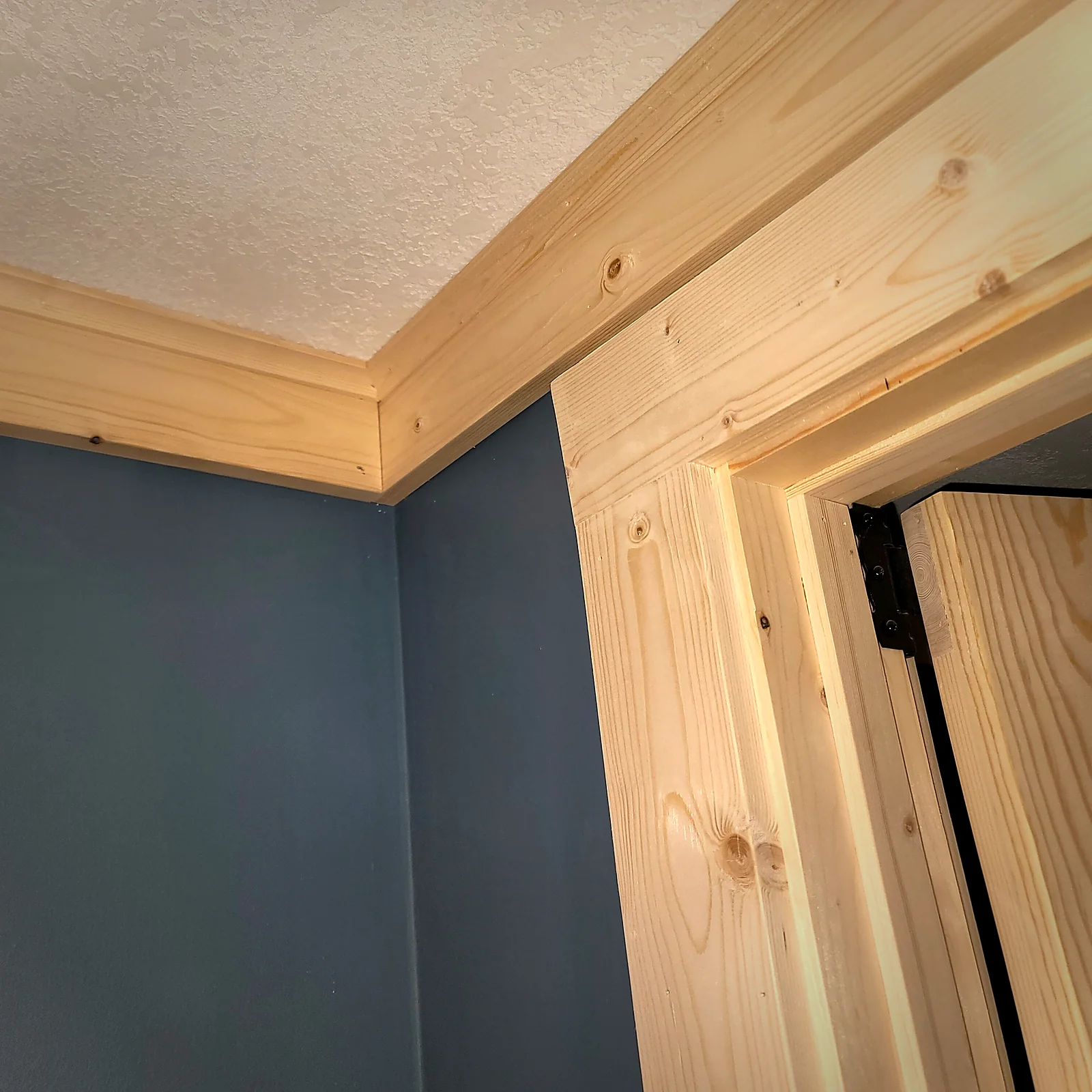 Hand-fit door trim and crown detail